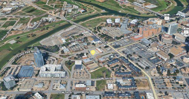 A yellow marker shows the location at Lexington and West Weatherford streets on the west side of downtown Fort Worth where prehistoric remains were discovered by construction workers on March 15, 2016.